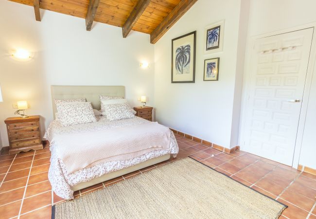 Dormitorio de esta casa rural en Alhaurín el Grande