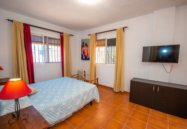 Dormitorio de esta casa rural en Coín