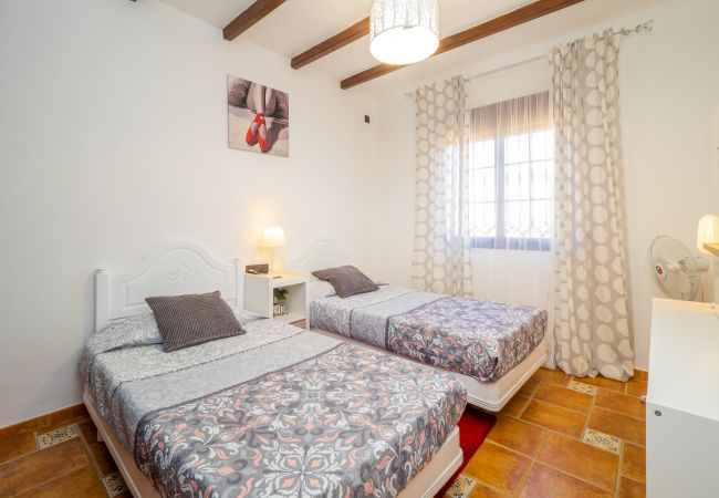 Dormitorio de esta casa rural en Alhaurín el Grande