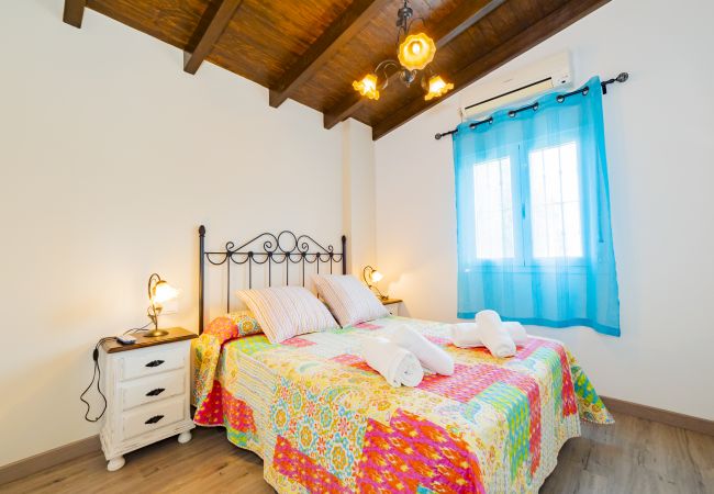 Dormitorio de esta casa rural en Pizarra