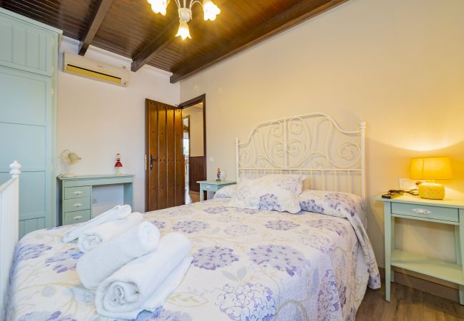 Dormitorio de esta casa rural en Pizarra