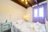 Dormitorio de esta casa rural en Pizarra