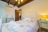 Dormitorio de esta casa rural en Pizarra