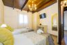 Dormitorio de esta casa rural en Pizarra
