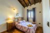 Bedroom of this house with fireplace in Alhaurín el Grande