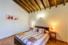 Bedroom of this house with fireplace in Alhaurín el Grande