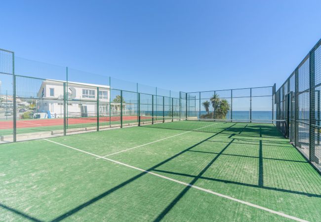 Paddle tennis courts in the common areas of this apartment in Marbella