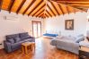 Living room with fireplace in this villa in Alhaurín el Grande