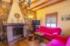 Living room with fireplace of this country house in Alhaurín el Grande