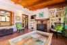 Living room with fireplace in this rural apartment in Mijas Pueblo