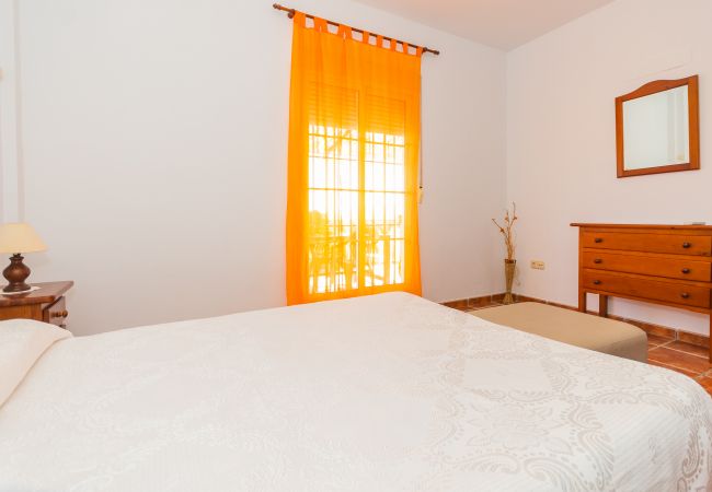 Bedroom of this house with fireplace in Coín