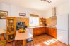Kitchen of this house with fireplace in Coín