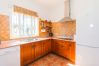 Kitchen of this house with fireplace in Coín