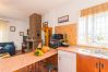 Kitchen of this house with fireplace in Coín