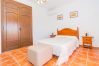 Bedroom of this house with fireplace in Coín