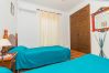 Bedroom of this house with fireplace in Coín