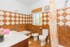 Bathroom of this house with fireplace in Coín